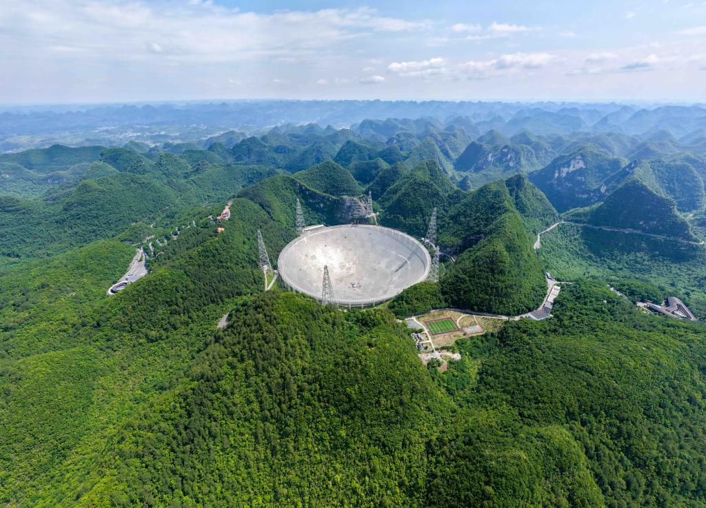 Aerial view of the FAST telescope in a mountain basin